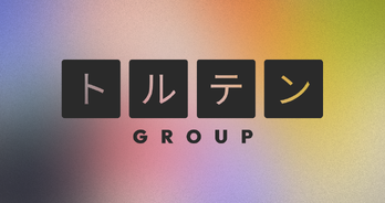 "Wordmark for TortenGroup composed of Katakana characters over a multi-colored gradient background."